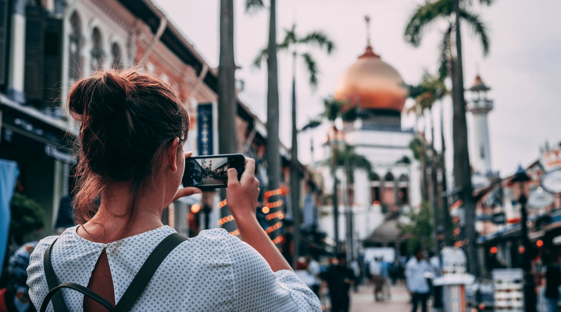 woman using a smartphone while traveling
