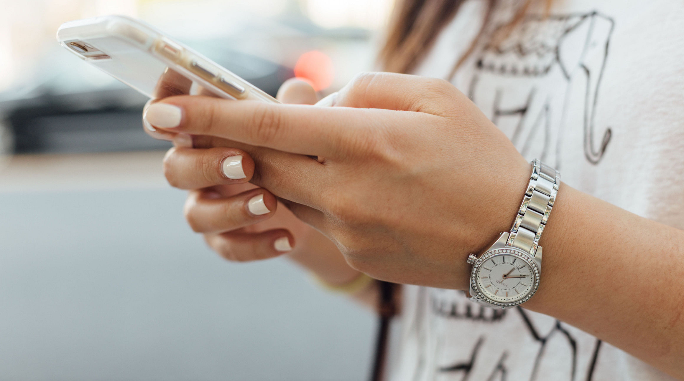 woman texting on a smartphone