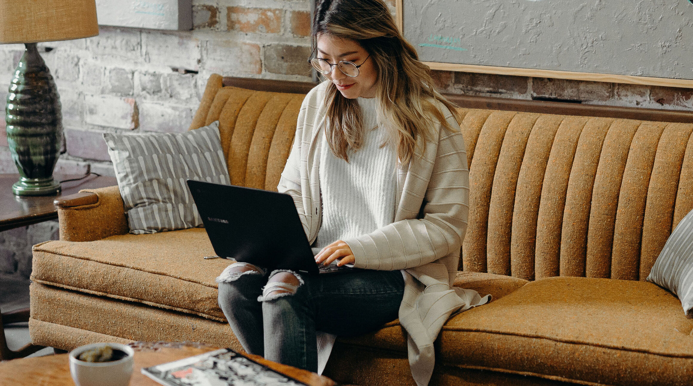 woman working on a laptop in a café