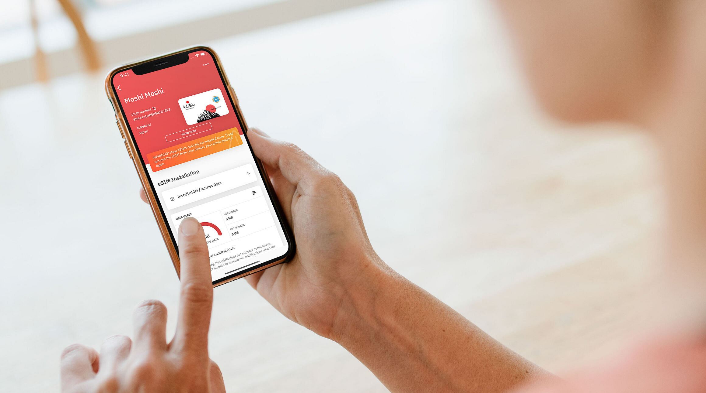 woman looking at a Japan eSIM on the Airzalo app